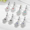 Gold and Silver Tone Pavé Crystal Hamsa Evil Eye Huggie Earrings view 2