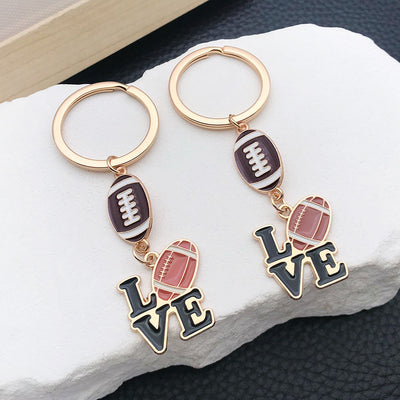 Main display of brown or red football and love letter keychains