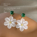 Gold Tone Green Square Stone And Translucent White Flower Earrings view 3