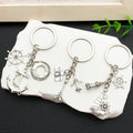 Antique Silver Nautical Anchor and Sailboat Keychain Set view 1