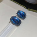 Pair of Metal Tone Blue Crystal Pave Rounded Hoop Earrings view 6