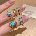 Gold Open Oval Turquoise Cabochon Twisted Band Ring view 1