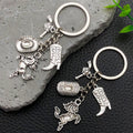 Antique Silver Western Hat Boot and Pistol Keychain Pair view 1
