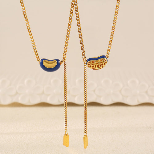 Blue enamel bean pendant front and filigree reverse on gold chain