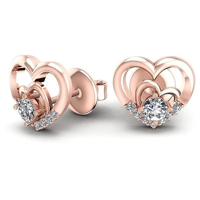 Front view of layered heart crystal stud earrings in three metal tones