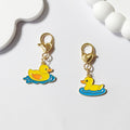 Gold Tone Yellow Duck Heart-Clasp Charms in Twelve Playful Designs view 3