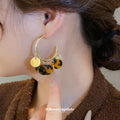 Gold Tone Hoop Earrings with Brown Tortoiseshell Disc Fringe view 3