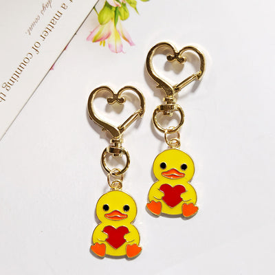 Main product view of yellow Heart-Holding Duck Charm with Gold Tone Heart Clasp