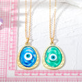 Gold Tone Oval Resin Evil Eye Pendant Necklaces in Six Colors view 5
