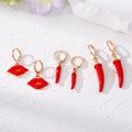 Gold Tone Red Enamel Chili Pepper and Lips Huggie Earring Set view 2