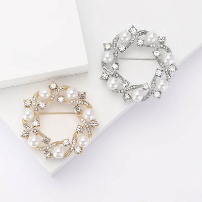 Front view of pearl wreath brooch with crystal leaf details decorative metal pin