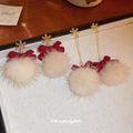 Bow Pom Pom and Snowflake Drop Earrings in Seven Styles view 1