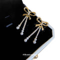 Gold Tone Bow Stud Earrings With Pearl Chain Tassels view 5