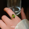 Gold Tone Olive Green Marquise Crystal Ring With Fan Side Clusters view 1