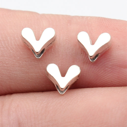 Mixed Metal v shape heart spacer beads, close front view