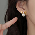 Polished Bow Pearl Drop Stud Earrings In Two Metal Tones view 2