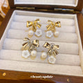 Bow Flower and Pearl Drop Ear Clips in Gold and Silver view 4
