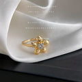 Gold Tone Wavy Floral Braided And Clear Stone Rings In Three Styles view 1