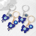 Gold and Silver Tone Blue Evil Eye Butterfly and Heart Keychains view 1