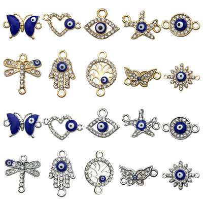Metallic butterfly and starfish charms arranged on a light background