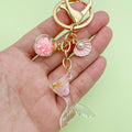 Starfish, Conch and Shell Charm Keychains Featuring Flower Across 31 Pictured Variations view 3