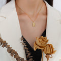 Rectangular Sunburst Pendant Necklace Gold Steel Rose Gold Tags view 4