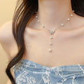 Butterfly and Pearl Drop Necklaces in Gold and Silver Tone view 4