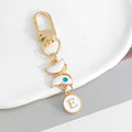 White Enamel Butterfly Evil Eye Letter Charm Gold Keychain view 9