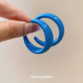 Glossy Blue Acrylic C Hoop Earrings With Decorative Metal Accents view 4