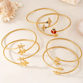 Gold Open Cuff Bracelets Dual Starfish Bee Ladybug Charms view 2