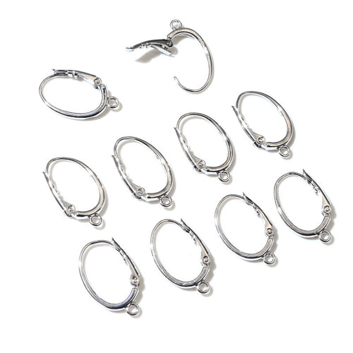 Overview of silver-tone oval hinged hoop findings with small bottom attachment loops on a light background