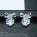 Silver Tone Bow Baguette and Round Clear CZ Stud Earrings view 1