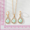 Gold Tone Crystal Teardrop Evil Eye Necklace and Earring Options view 2