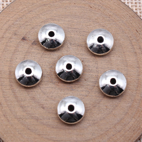 Smooth Wheel Spacer Beads in Four Metal Tone Finishes shown in image 2 with a rounded wheel profile