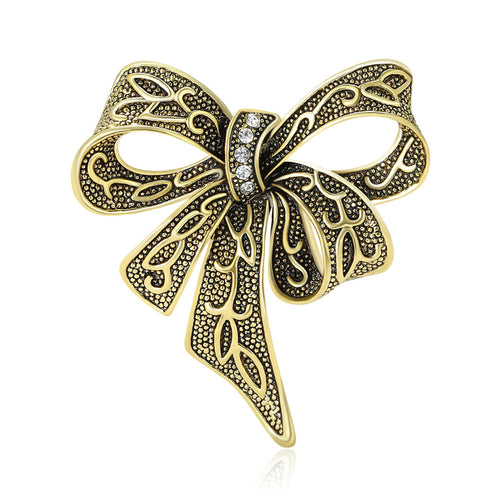 Front view of the openwork ribbon bow brooch showing an openwork ribbon bow with dark antiqued line details