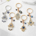 Crystal Hamsa Hand and Blue Evil Eye Metal Keychains view 1
