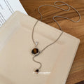 Silver Tone Chain Necklace with Brown Vase Pendant view 4