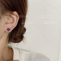 Silver-Tone Mini Blue CZ Four-Petal Flower Stud Earrings Pair view 3