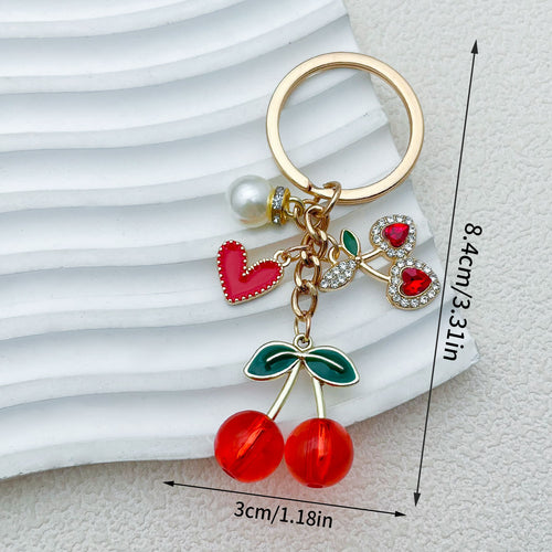 Dimension graphic showing strawberry, cherry and lemon keychains with printed 8.4cm/3.31in and 3cm/1.18in measurements.