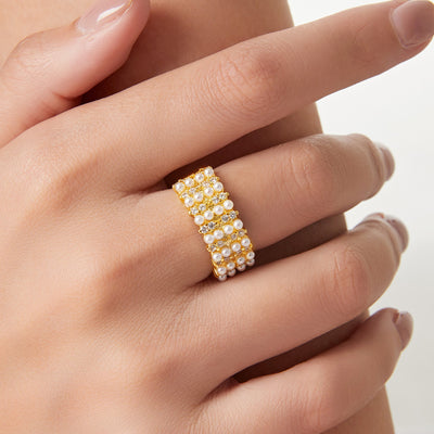Gold open pearl zircon wide ring worn on finger
