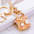 Fabric Lock Handbag Keychains in Pink Black Orange and Blue plus Assorted view 1