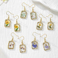 Gold Tone Rectangular Pressed Flower Drop Earrings in Five Designs view 1