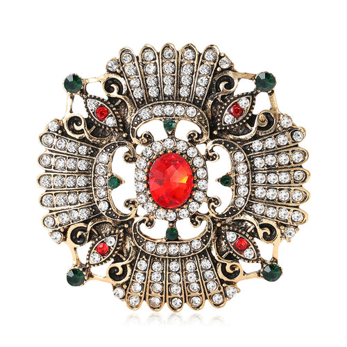 Angled view showing layered clear crystals dark accents and filigree metal