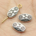 Embossed Double Flower Oval Metal Beads in Three Antique Finishes view 1