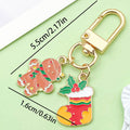 Christmas Charm Keychains Featuring Christmas Across 41 Pictured Variations view 7