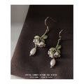 Gold Tone Green Leaf Lily Flower And Baroque Pearl Hook Earrings view 1