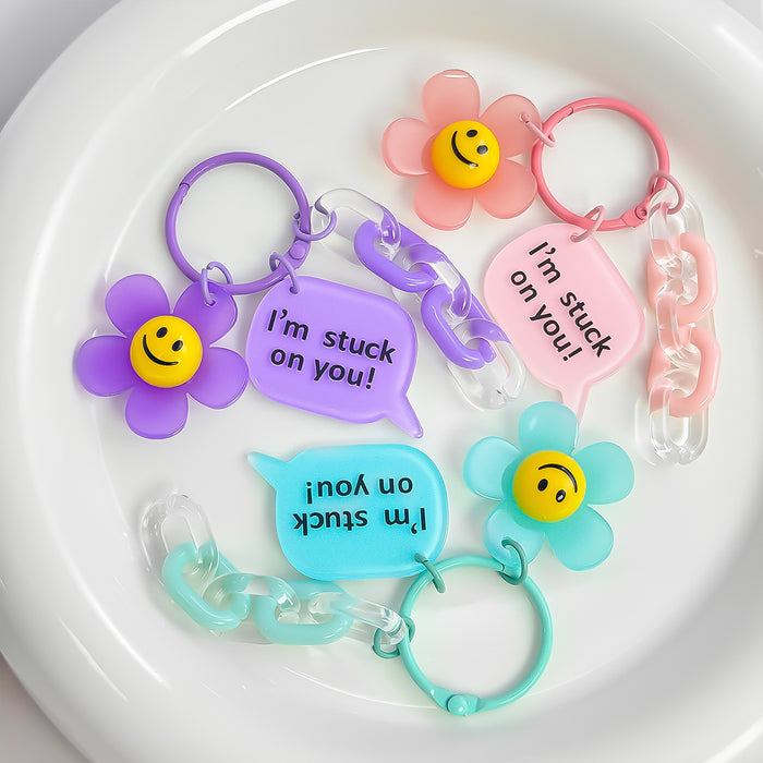 Smiley Daisy Charm Keychain With Speech Bubble Tag And Acrylic Chain