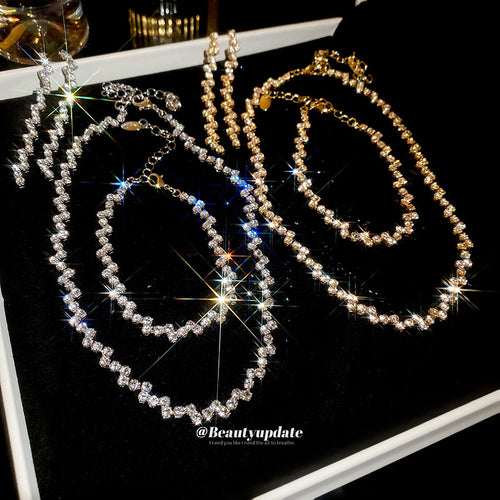 irregular crystal fringe necklace, bracelet, and earring set in gold or silver tone shown in the first close product vie