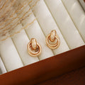 Interlocking Double Ring Polished Gold Tone Stud Earrings view 4