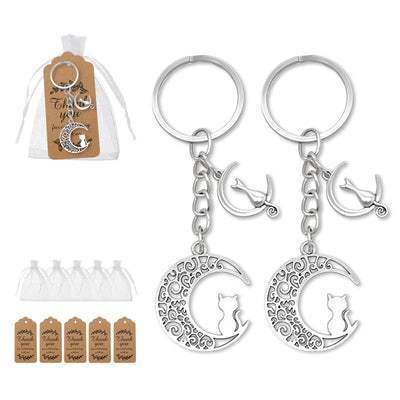 Two silver moon cat keychains with organza bags and kraft tags